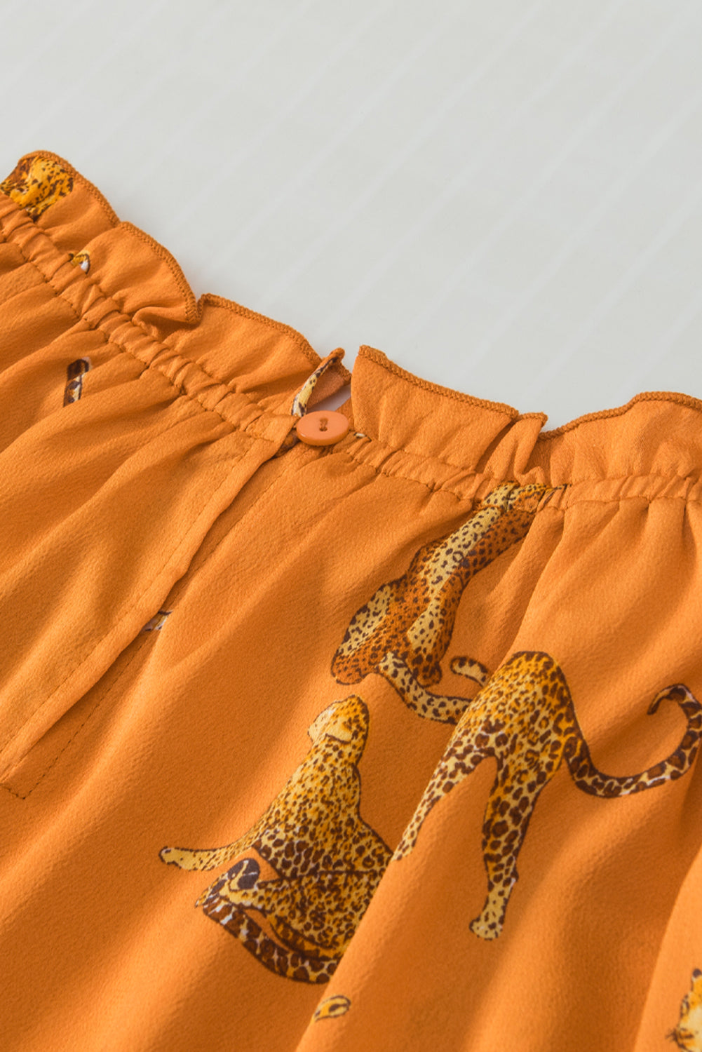 Blouse à manches à volants imprimées orange guépard