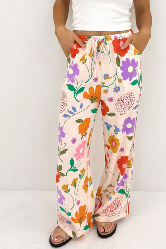 Pantalones sueltos con estampados florales naranjas