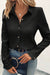 Black shirt with folded collar and textured buttonée of a plain color