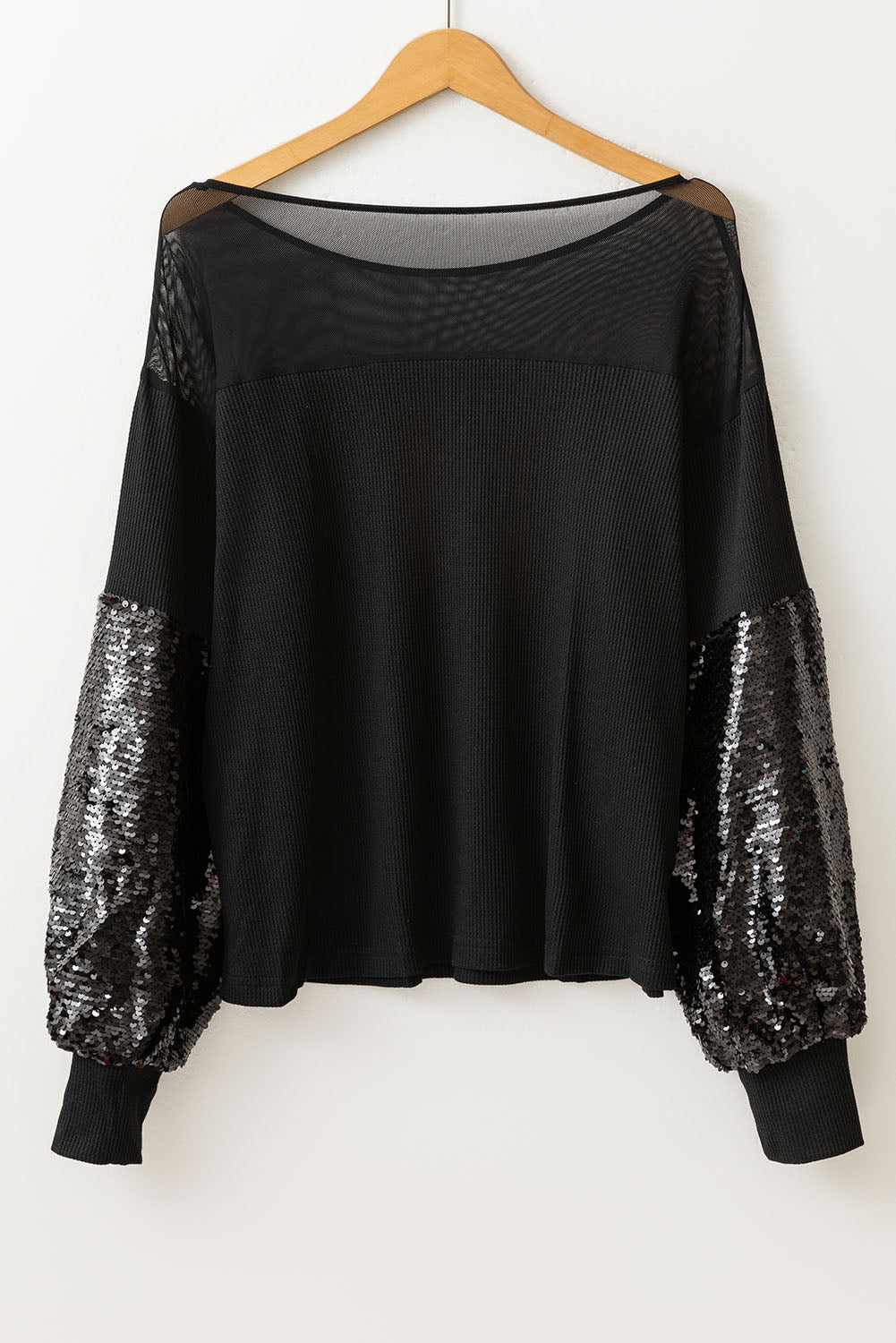 Blouse noire à manches lanternes et patchwork de sequins