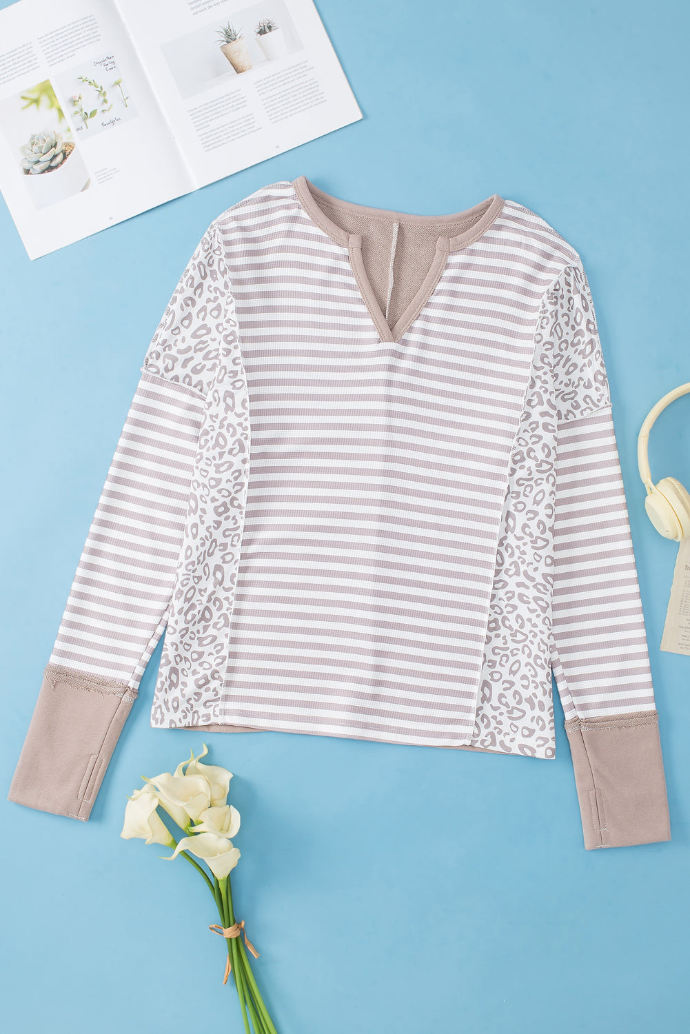 White top with sleeves with thumbhole and leopard striped patch