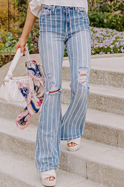 Flared jeans torn with vertical blue sky stripes