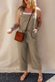 Sage green short overalls with buttoned straps and drawstring