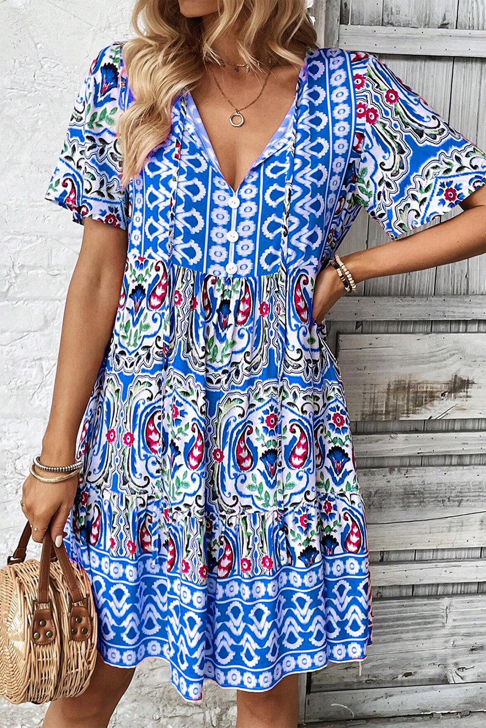 Sky blue bohemian print short dress with knotted neck and ruffled hem