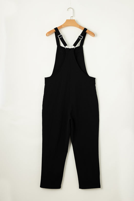 Black short jumpsuit with adjustable straps and buckle