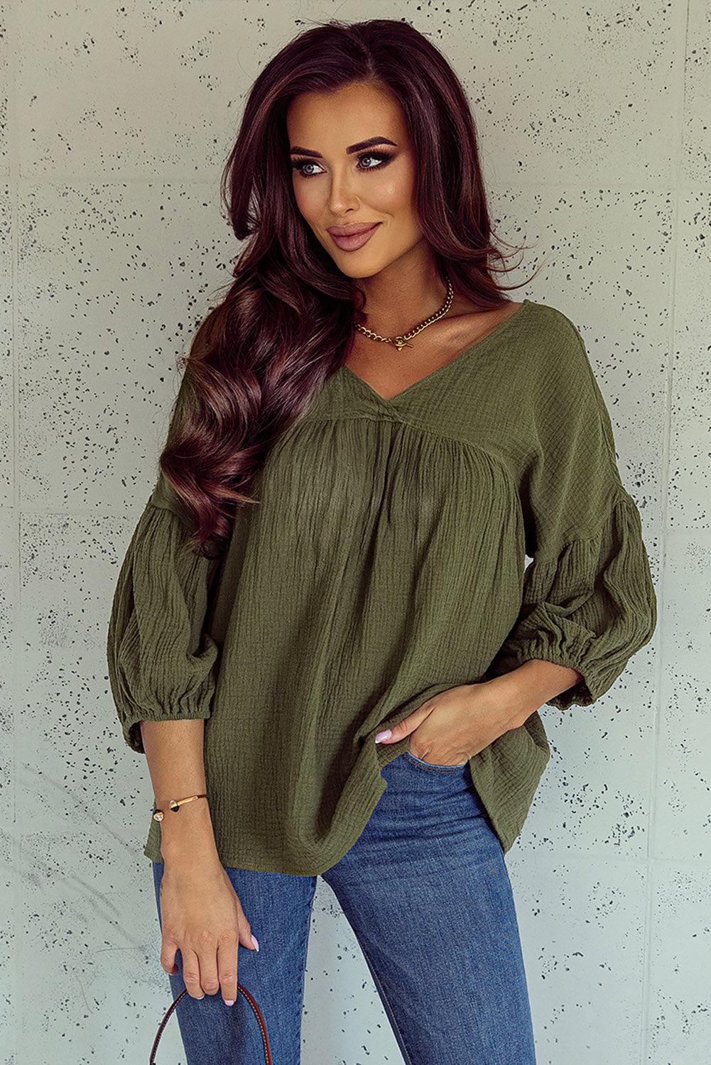 Textured green babydoll blouse in V -collar and bracelet sleeves