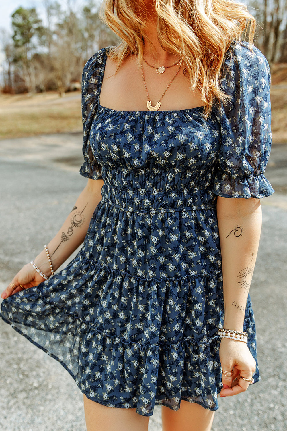 Short dress with ruffles and floral smocking in voile blue