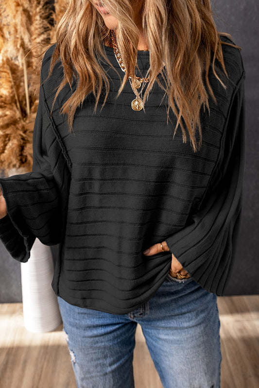 Black ribbed knit dolman top with exposed seams