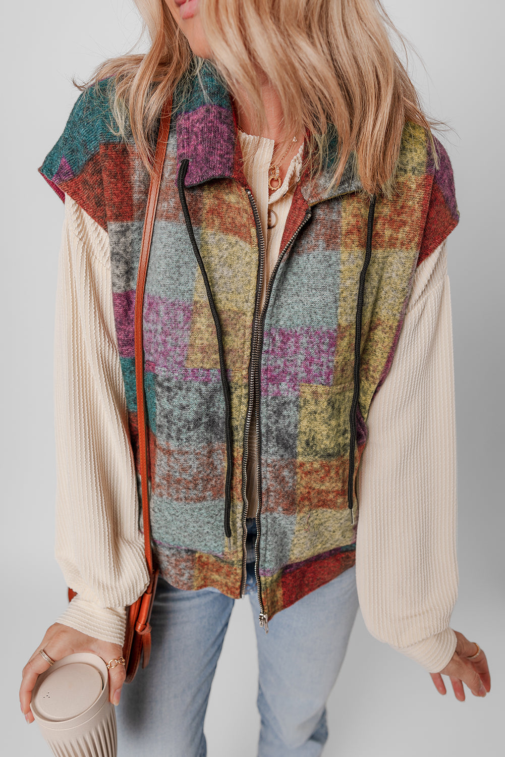 A large zipped vest with multicolored Scottish print with side pockets