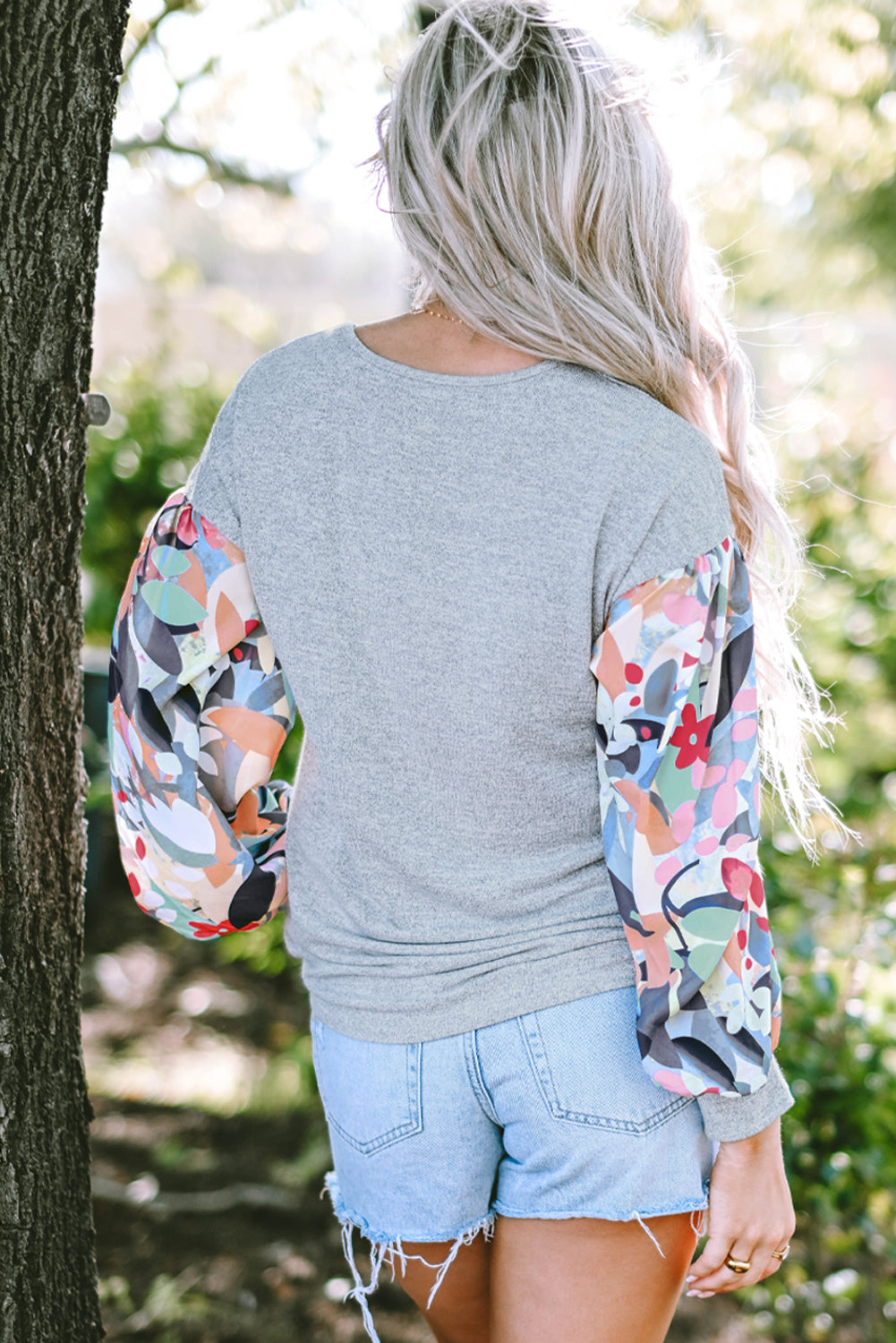 Gray floral top with lantern sleeves, buttoned patchwork, V-neck