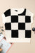 Black sweater with short sleeves and round tiles color block