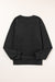 Black sweatshirt with snap buttons and side slits