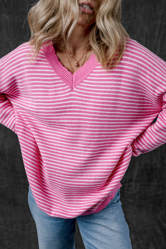 Loose V-neck sweater with pink striped slits