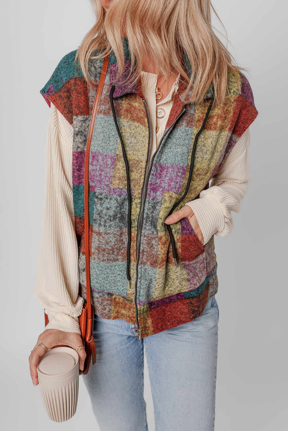 A large zipped vest with multicolored Scottish print with side pockets