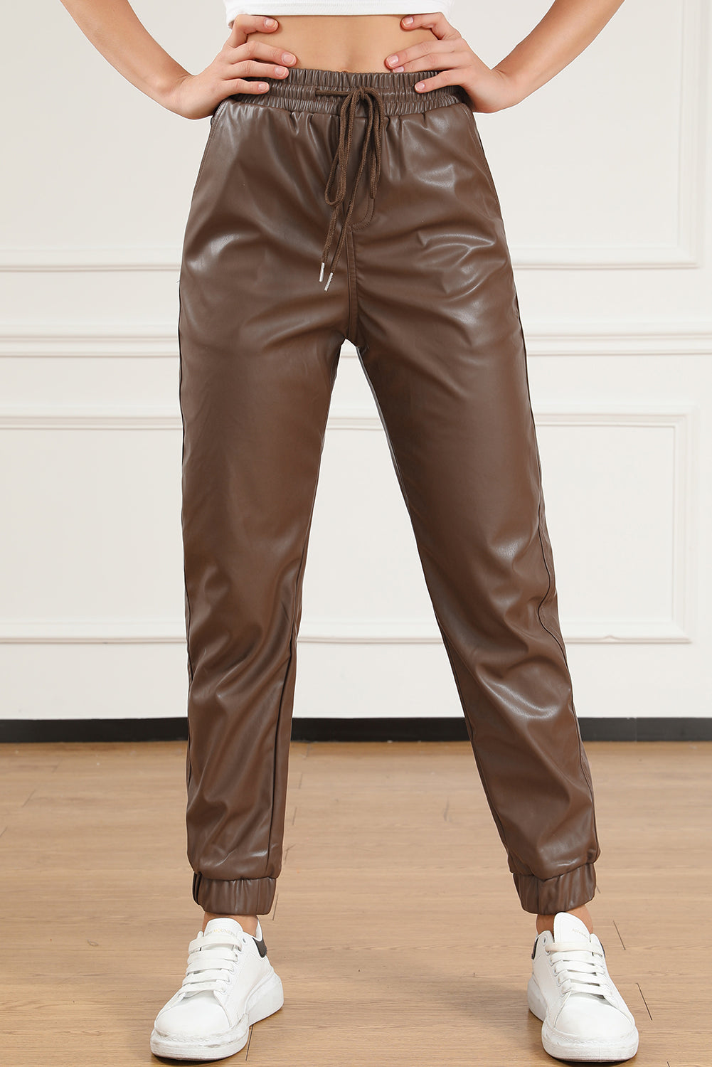 Brown leather jogging pants with waist tie