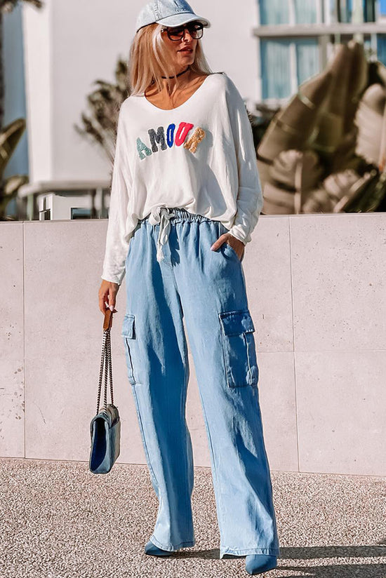 Jeans azules grandes de pierna y bolsillo de carga de cintura alta con cordón apretado