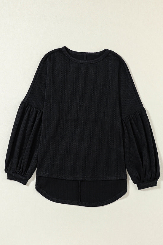 Black long puff sleeve top in faux knit jacquard