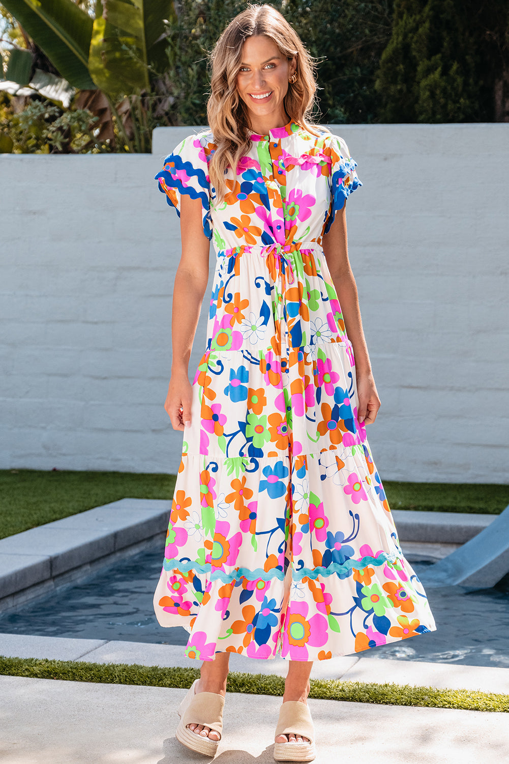 Long floral dress buttoned with floating sleeves and ricrac pink border