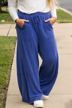 Grandes pantalones de cintura alta con cordón apretado y cintura de cielo azul de bolsillo grande