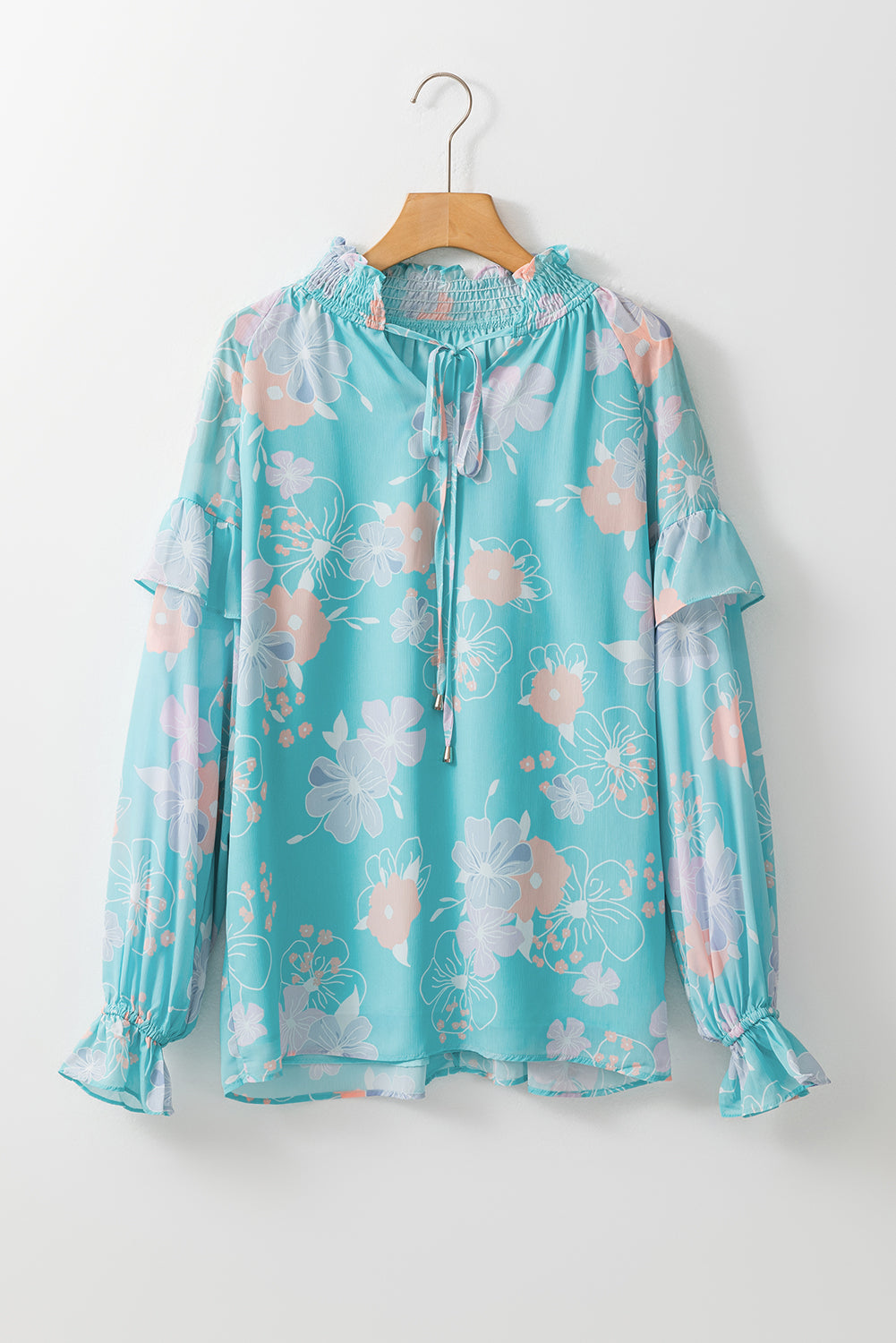 Blouse à manches bouffées à cou de cou floral bleu ciel