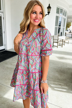 Light blue dress with puffy sleeves and abstract printed ricrac ruffles