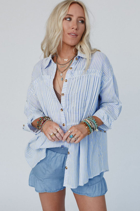 Long sleeve shirt buttoned with sky blue striped